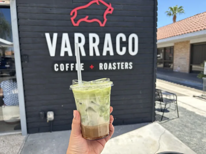 A specialty drink in front of Varraco Coffee and Roasters in Palm Desert