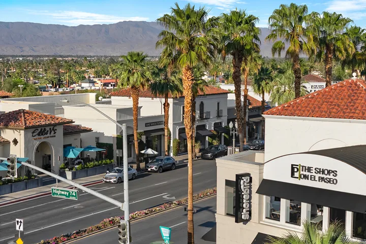 Palm-lined El Paseo shopping district with the San Jacinto Mountains beyond