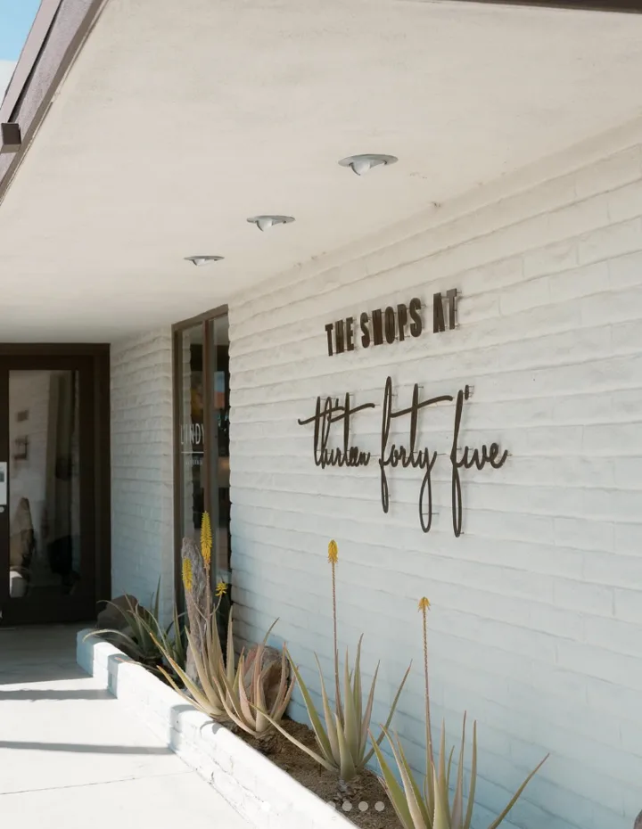 The Shops at Thirteen Forty Five exterior sign and desert landscaping in Palm Springs